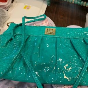 Women cross over purse. New green